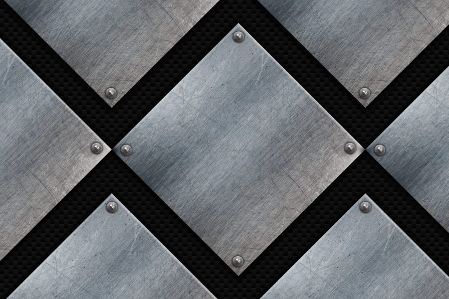 Grunge metal plates on a carbon fibre texture